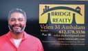 Bridge Realty — Velen M. Ambalam logo